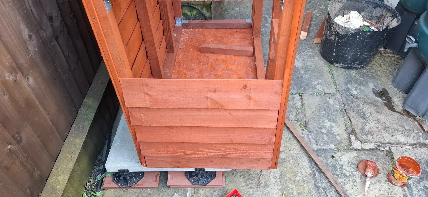 The back panel with cladding boards partially fitted